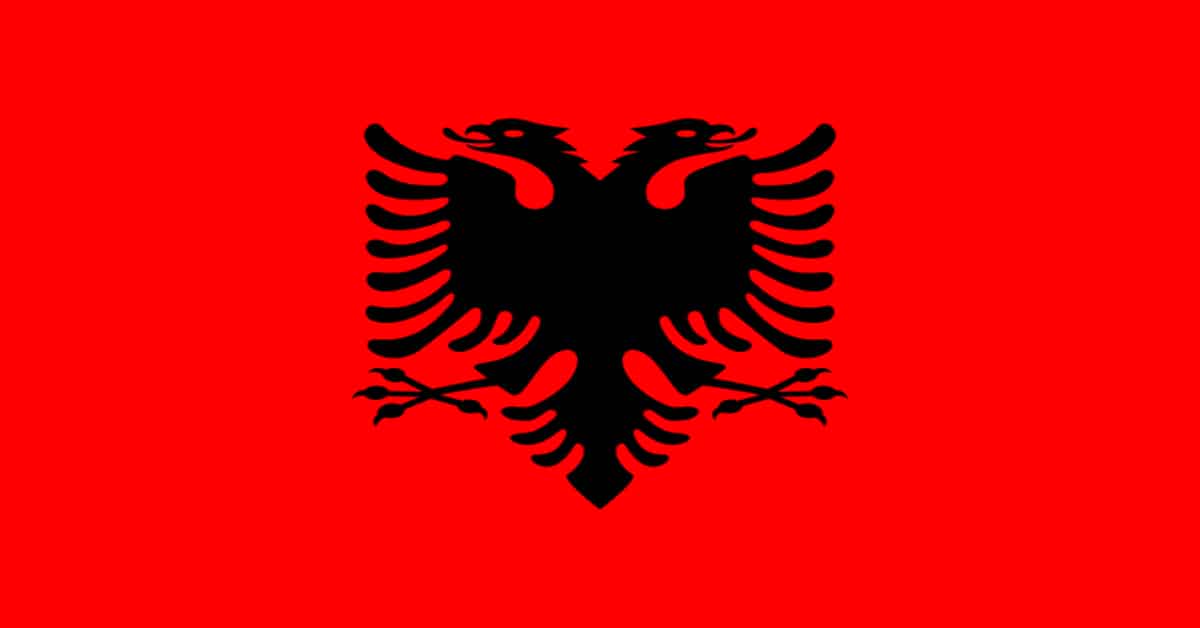 red and white flag with eagle in the middle